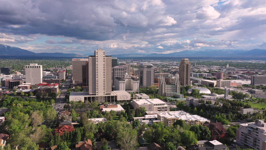 Rotating aerial view looking at downtown Salt Lake City Utah and Temple Square.