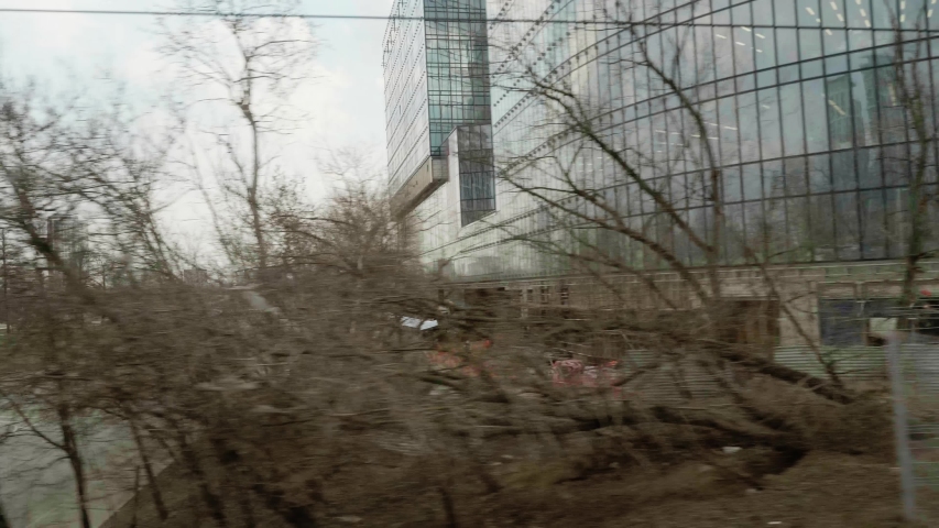 View of road in city from window of moving train