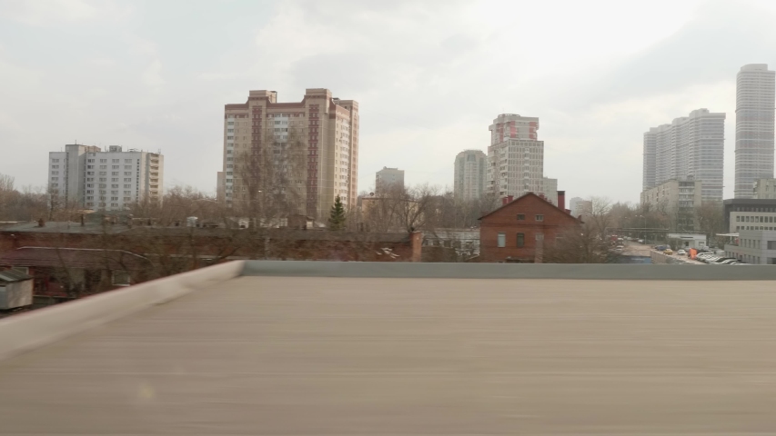 View of rail way form window of moving train. Transport of Moscow. Autumn day