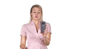 Beautiful blond head lady making video call using cell phone on white background.