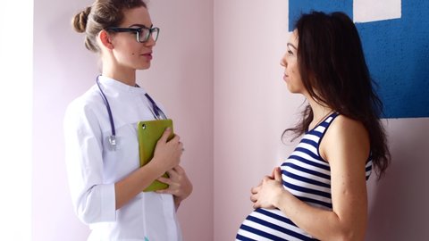 pregnancy, gynecology, medicine, health care and people concept - gynecologist doctor and pregnant woman meeting at hospital.