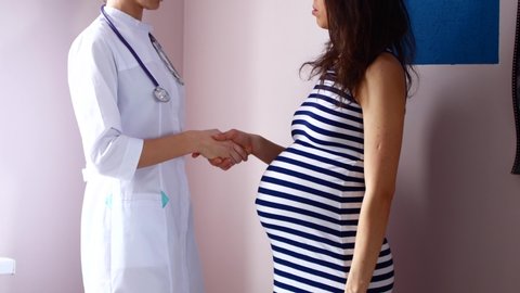 pregnancy, gynecology, medicine, health care and people concept - gynecologist doctor and pregnant woman meeting at hospital.