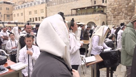 Jerusalem, Israel- May 24, 2019
jewish orthodox man pray, crowd of prayers western wall temple  singing man pray