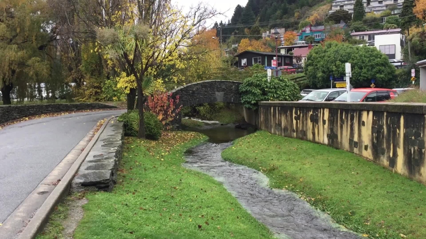 Bridge road and creek in Queenstown, New Zealand