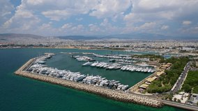 Aerial video of famous Marina Floisvou with luxury yachts and sail boats in the heart of Faliro, Athens, Attica, Greece