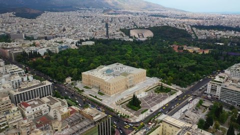 Aerial video of famous landmark building of Greek parliament in the heart of Athens, Syntagma square, Attica, Greece