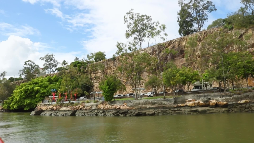 Tracking shot of Kangaroo Point Cliffs Park in Brisbane from the Brisbane River.