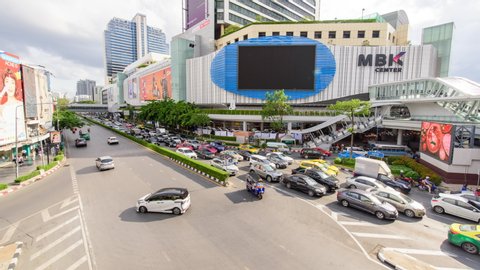 Bangkok , Thailand - 12 June, 2019 : Time lapse of a lot of traffic car at  MBK shopping center in Bangkok