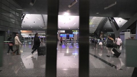 Doha, Qatar - February 24, 2019: gate of entrance hall of Hamad International Airport or Doha Hamad Airport, the only airport in Qatar open to civilian traffic, opened in 2014. POV entering gate.