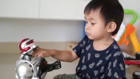 Baby boy playing robot at home