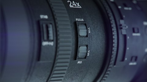 Panning to Professional Video Camera Lens
Video camera lens,  Side view of a video camera is changing into its front view. close up.
4K ProRes.