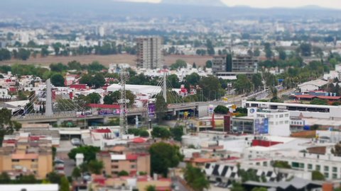 Tilt shift overview of Cholula bridge in Mexican city. Panoramic view of Ruta Quetzacoatl, San Andres Cholula, Mexican Federal Highway 190, Puebla, Mexico, in June 2, 2019.
