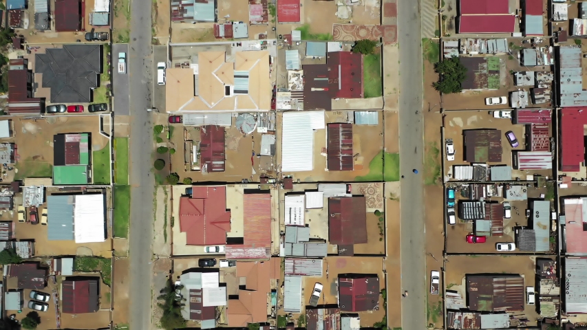 Aerial top down view from above South African township or ghetto in Soweto showing the social lifestyle and challenging living conditions within the slum.