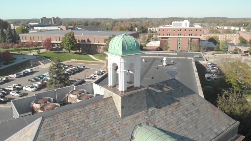Bell on building - historical bell - metal bell, on top of a beautiful building - architecture at its best. Drone shots from above.