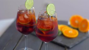 Refreshing sangria cocktail with fruit and ice