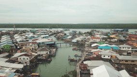 Drone view of fishing boats and village of pulau ketam, malaysia