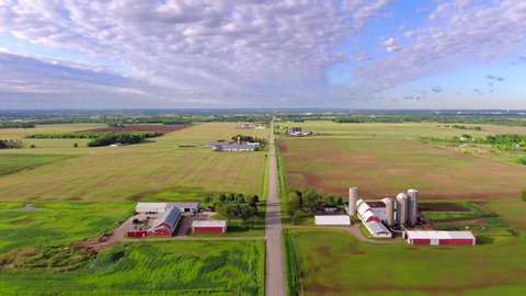 Exceptionally scenic country road, farm, agricultural landscape aerial flyover.
