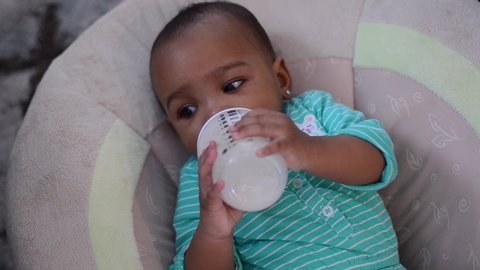 7 month old drinking milk right aligned