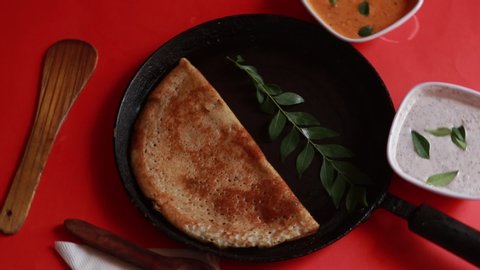 masala dosa,South Indian meal Set Dosa ,sambhar and coconut chutney on red background
