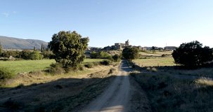 Aerial video with drone of the medieval village of Bonilla de la Sierra with Gredos in the background. It is one of the most beautiful villages in Spain