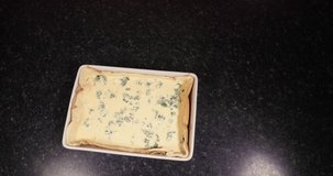 Reverse Clip Of Lady Using Spreader To Finish Off A Delicious Cheese And Spinach Quiche To Put It In The Oven To Bake 4K 30FPS - Cheddar, Spinach, Bowl, Mixture
