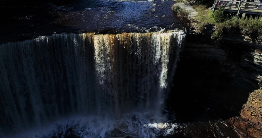 Flying away from the big falls at Tehquamenon Falls in Northern Michigan. Brown water is from the copper rich soil