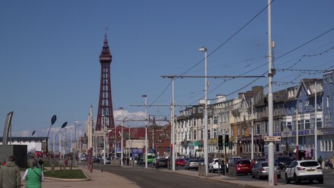 Blackpool, Lancashire / England - June 03 2019: Built in 1894, the landmark Blackpool Tower houses a circus, a glass viewing platform and the Tower Ballroom, UK 4K.