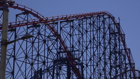 Blackpool rollercoaster with blue sky England tourist destination UK 4K.