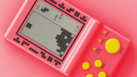 Moscow, Russia - June 06, 2019: Rotating retro tetris electronic game on a pink background. Vintage style pocket brick game. Interactive playing device. 3d animation
