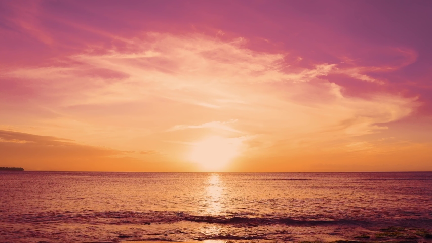Red sunsets over sea video 4K. The sun touches horizon. Red sky, yellow sun and amazing sea. Summer sunset seascape. Atlantic Ocean beach sunsets. The sun in spindrift clouds Fantastic natural sunsets Royalty-Free Stock Footage #1031456045