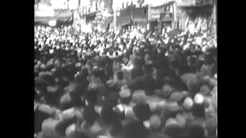 CIRCA 1930s - Raw silent footage of Gandhi in India in 1930 and rioting between Hindus and Muslims.
