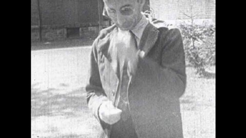 CIRCA 1940s - Silent footage from a lunatic asylum in the 1940s with patients displaying various forms of psychological disorders.