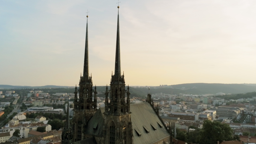 Aerial View of Medieval Gothic basilica Church on Petrov Hill and Old Town at Sunset. Brno, Czech Republic, Cathedral Of St. Peter And St. Paul. 4K Panning Drone Shot