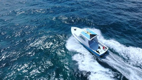 Fishing Boat Speeding Through The Sea Of Grand Bahama, Bahamas