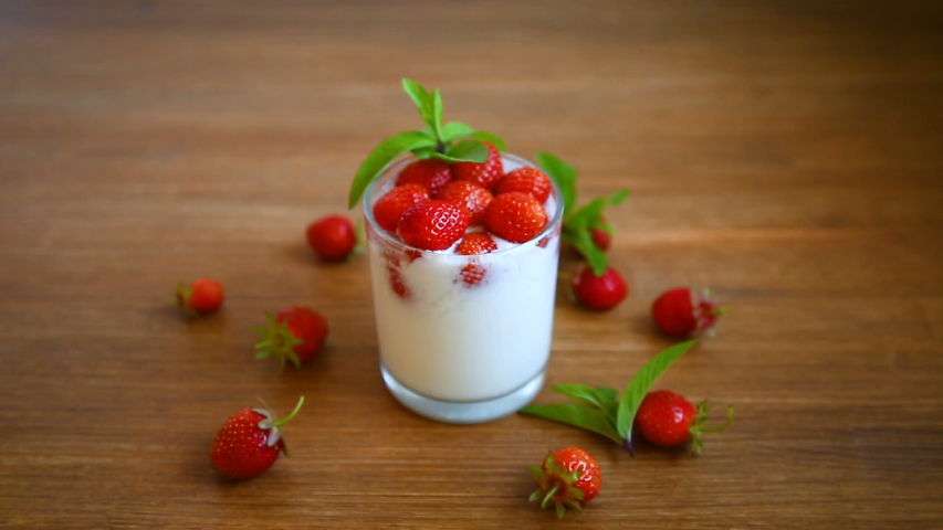 sweet homemade yogurt with fresh ripe strawberries