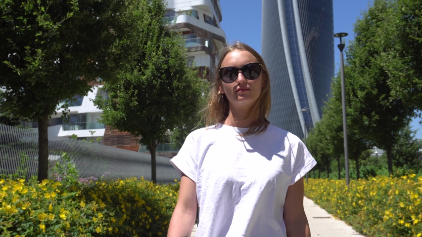 Beautiful Woman Walking on a Sunny Day in Milan, Italy