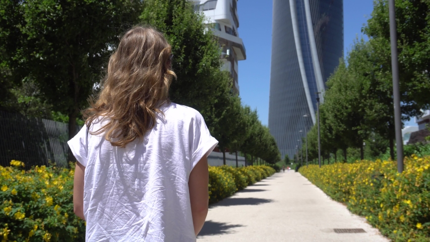 Beautiful Woman Walking on a Sunny Day in Milan, Italy