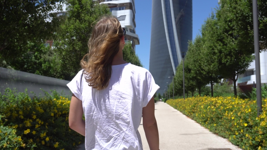 Beautiful Woman Walking on a Sunny Day in Milan, Italy