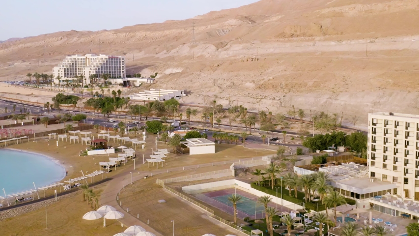Dead sea hotels beach in Israel, 4k aerial color graded sunny summer day