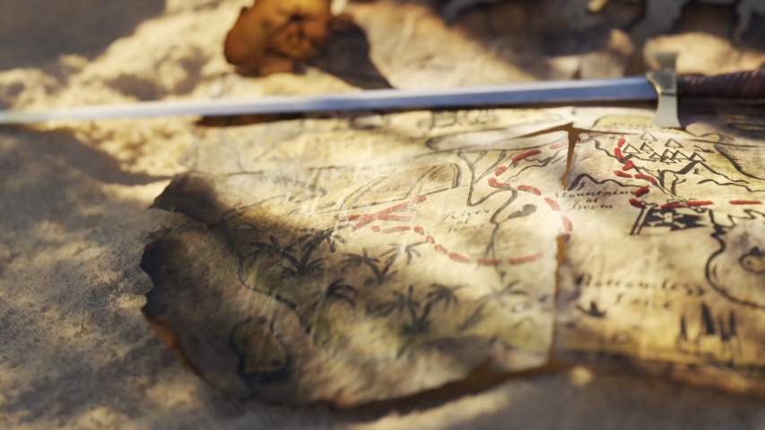 Old, worn handmade treasure map on tropical beach sand near the dig site. Treasure chest full of expensive jewellery, coins and ruby stones. Colorful palm trees, bright sand and clean turquoise water.