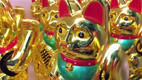 many golden asian lucky cat toys wave their arms