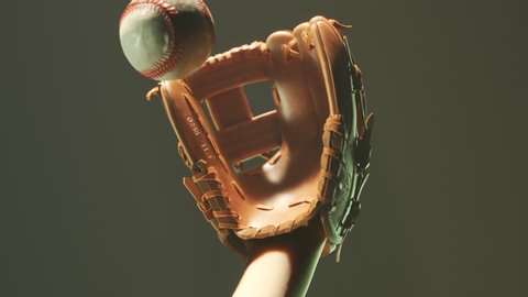 Dynamic baseball catch in the spotlight. Epic foggy slow motion shot of ball flying towards the glove. Dust particles appearing as the ball losing its momentum in the glove. 4KHD
