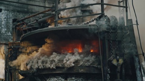 Metal smelting furnace in steel mill. Molten metal Pouring, metallurgy, Steel casting foundry. Steel manufacturing