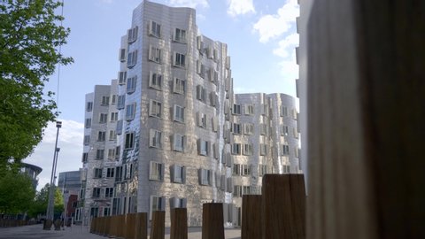 Dusseldorf, Germany - May 10, 2019: View of the Neuer Zollhof in Media Harbor, Dusseldorf, Germany. This building was designed by Frank O. Gehry and completed in 1998.