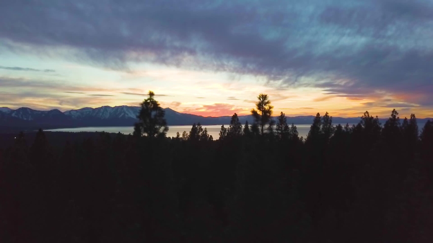 284 Lake Tahoe aerial sunset revealing through tree silhouettes