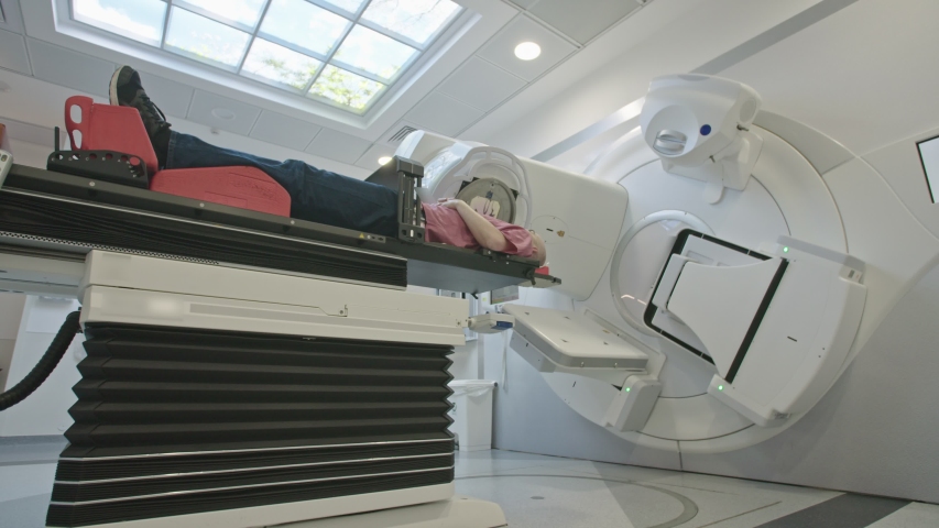 Patient Getting Radiation Therapy Treatment Inside A Modern Radiotherapy Room Royalty-Free Stock Footage #1031553140