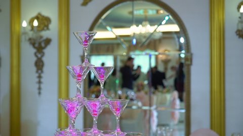 Pyramid or tower of glasses for champagne performance at the party