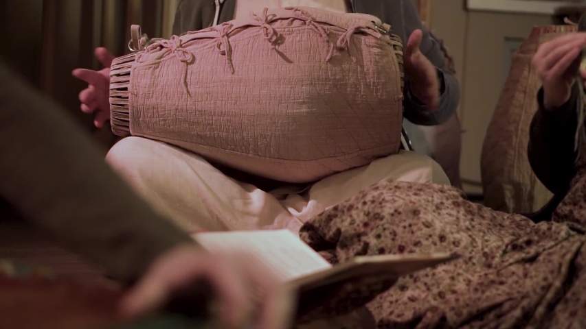 Close up for men hands playing national drum instrument and small percussion cymbals, music concept. Clip. People playing ethnic music with the help of unusual instruments.