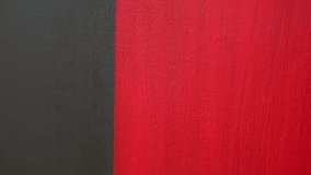 Red and black acrylic textured background as an abstract Contemporary  Art painting. Selected focus. Blur bokeh.