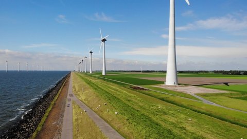 Offshore Windmill farm in the ocean Westermeerwind park , windmills isolated at sea on a beautiful bright day Netherlands Flevoland Noordoostpolder